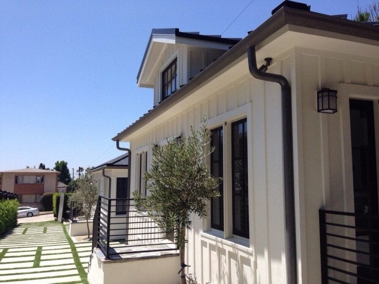 dark painted gutters on light painted house