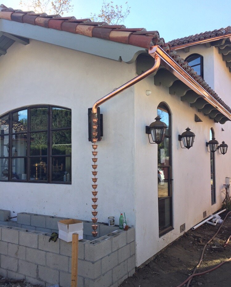 Copper gutters and rain chain on Spanish colonial